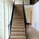 A shot showing both sides of the staircase going up.