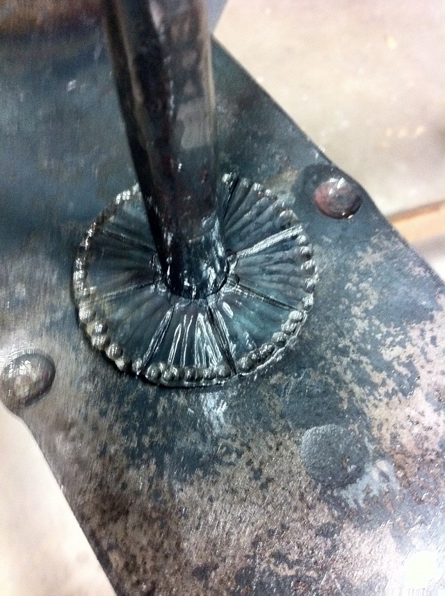 A rosette on the potrack made with special hot carving tools.